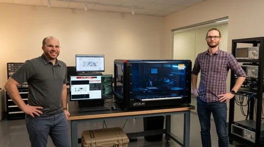 The Electroninks team standing with the CircuitJet IV at the Kirtland AFB demonstration